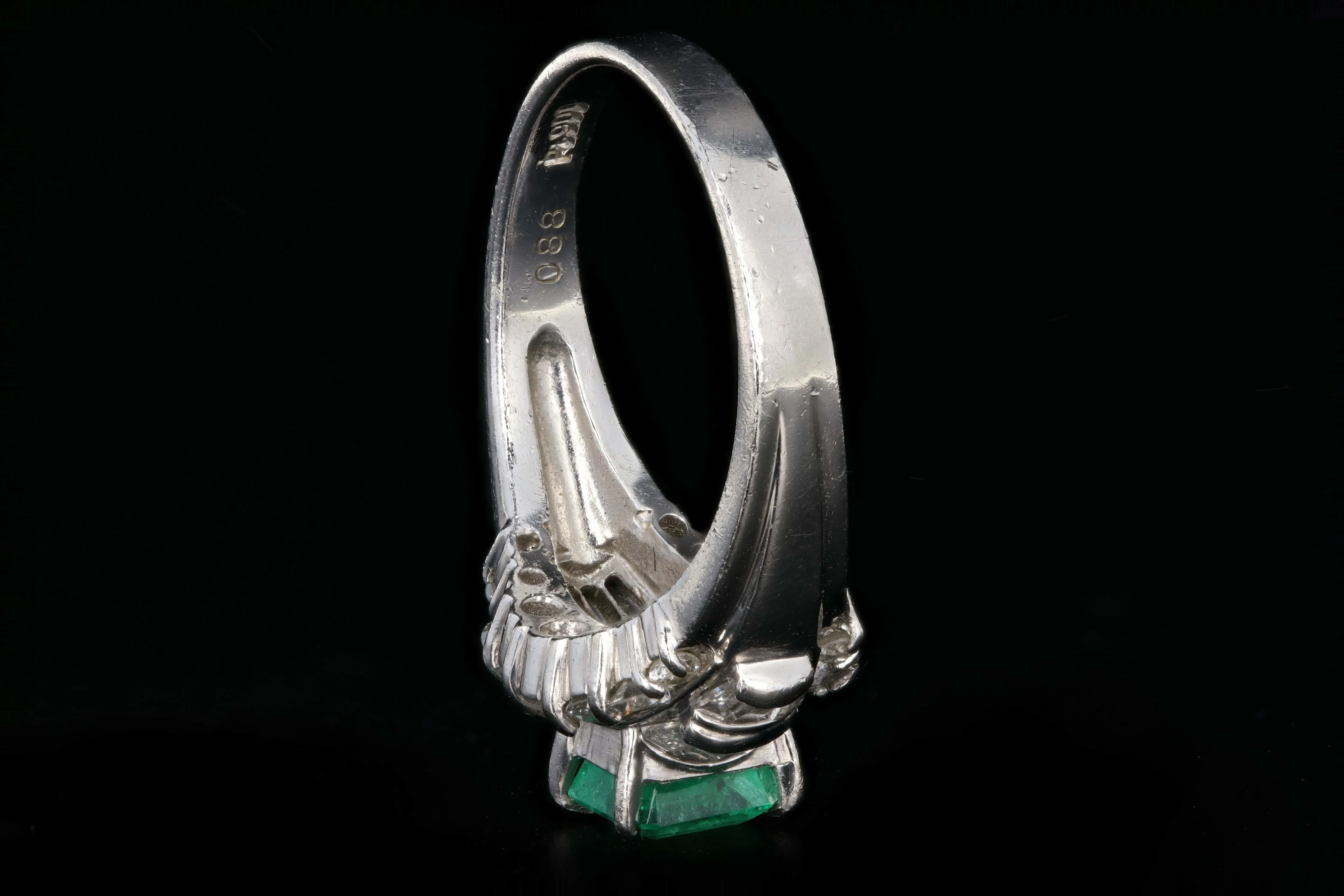 Retro Platinum .88 Carat Natural Emerald and Baguette Diamond Ring
