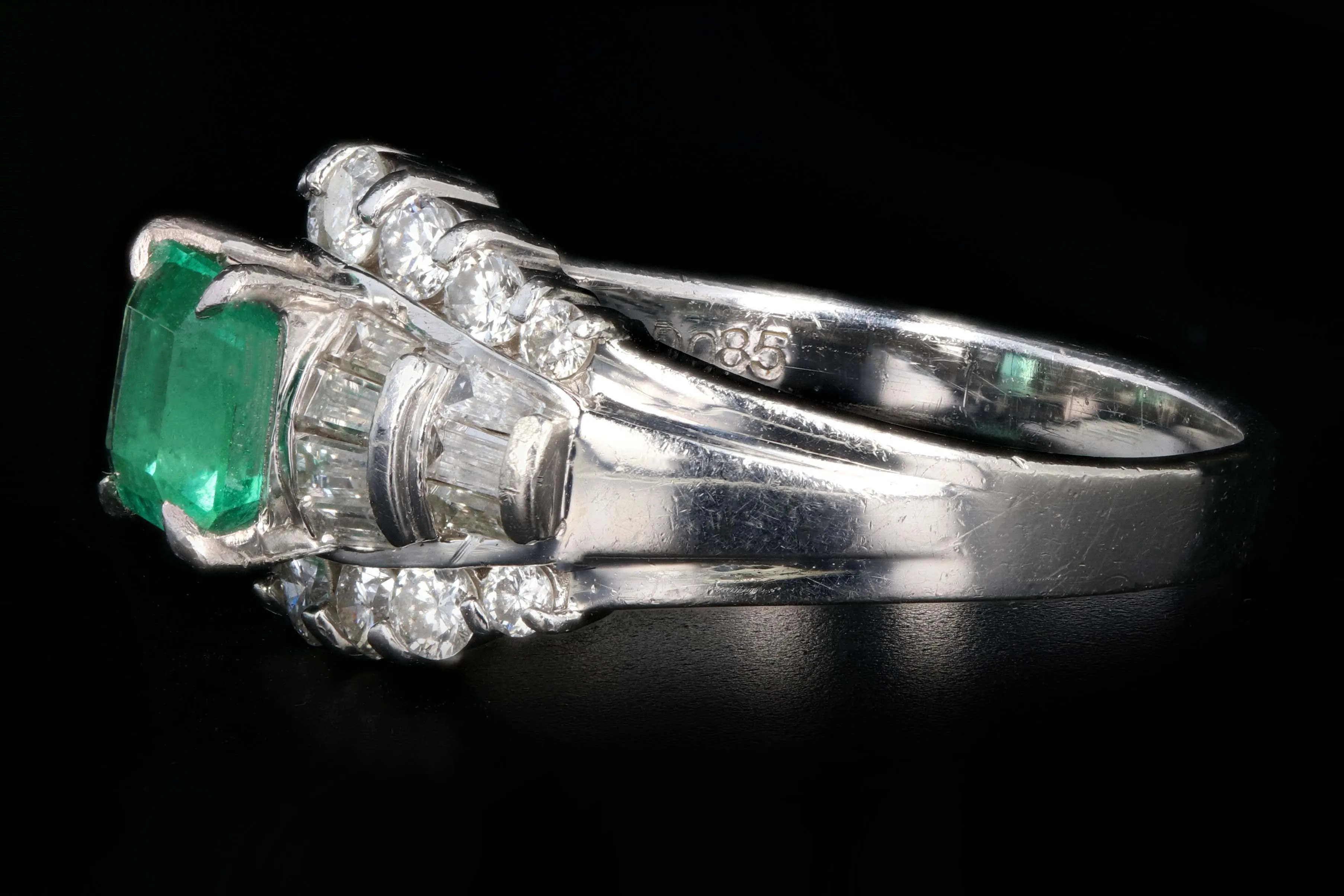 Retro Platinum .88 Carat Natural Emerald and Baguette Diamond Ring