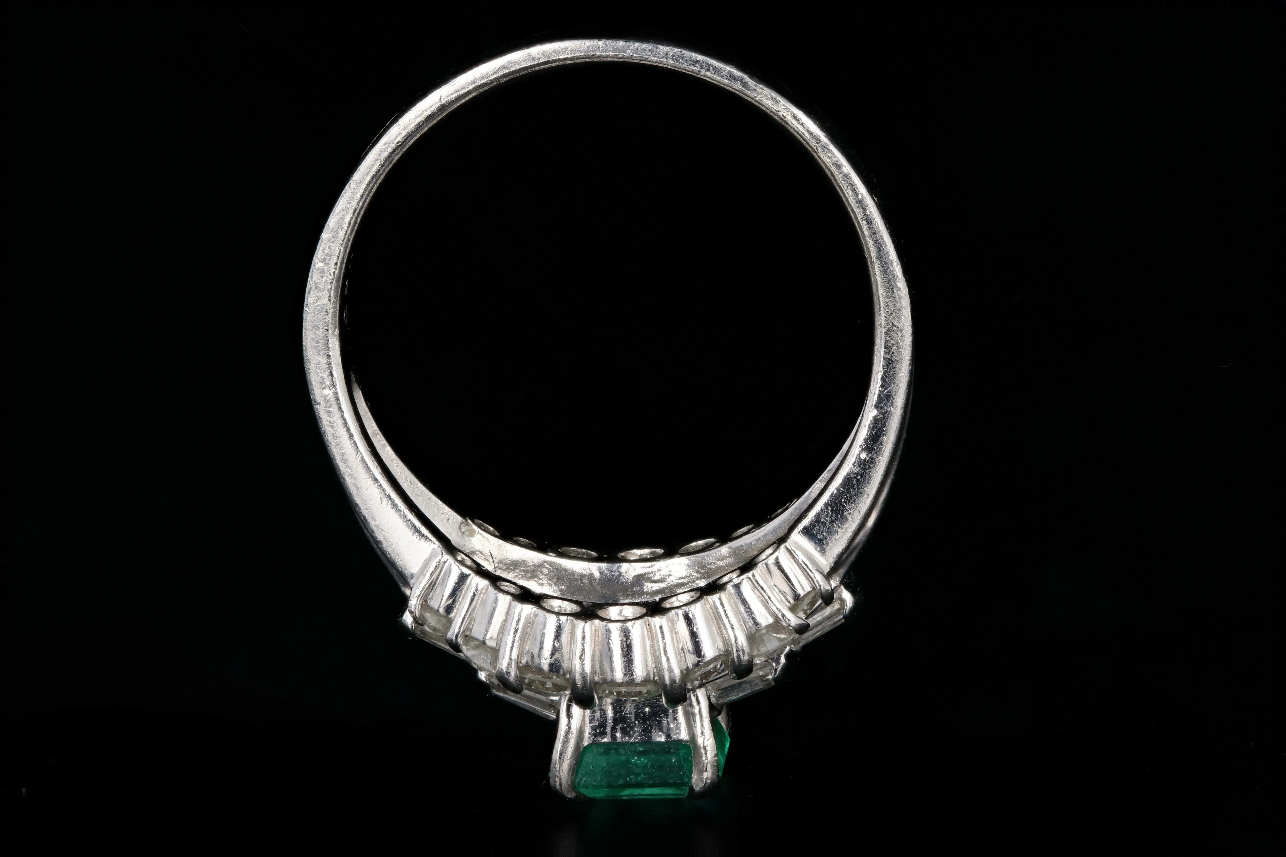 Retro Platinum .88 Carat Natural Emerald and Baguette Diamond Ring
