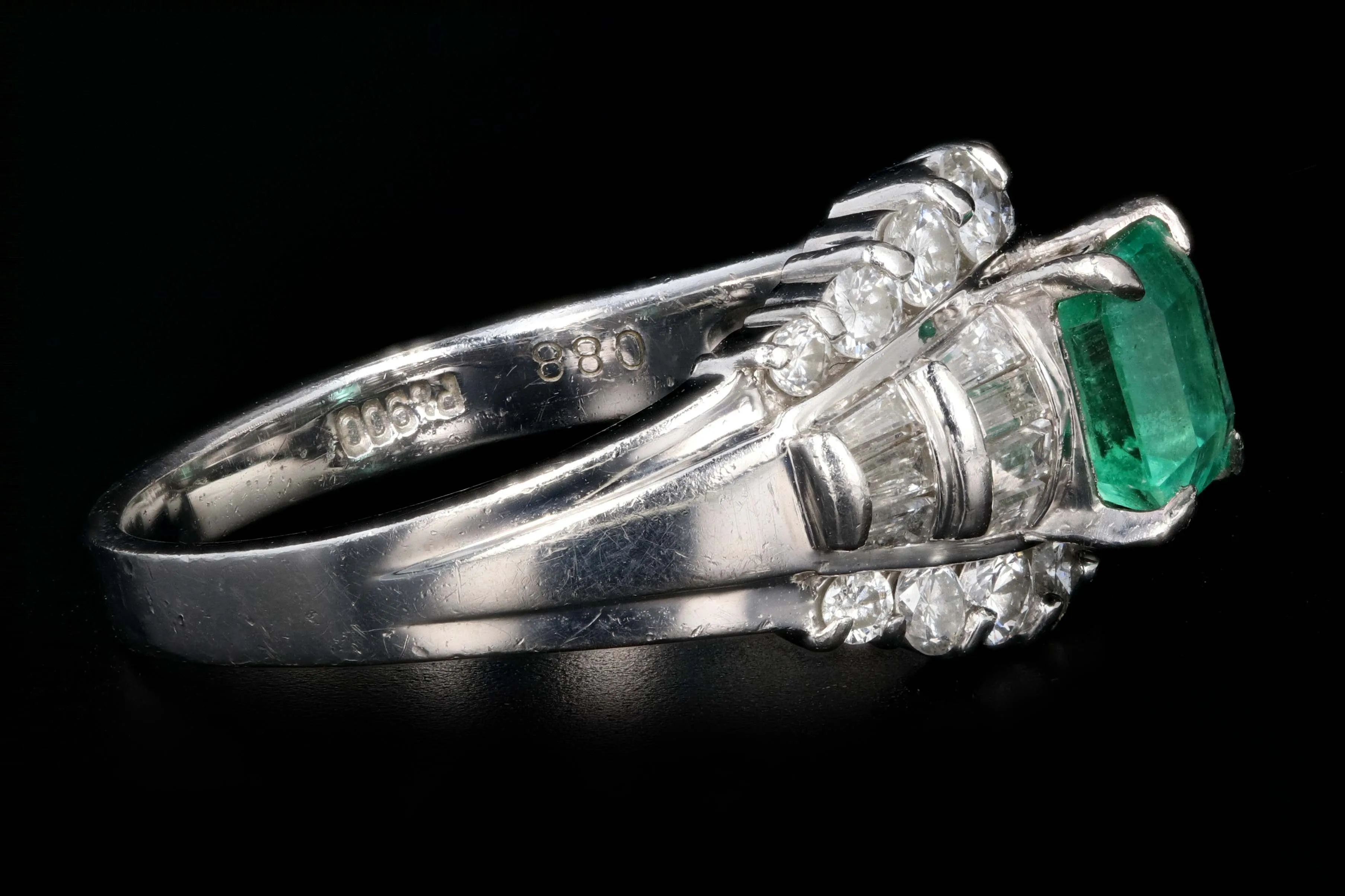 Retro Platinum .88 Carat Natural Emerald and Baguette Diamond Ring